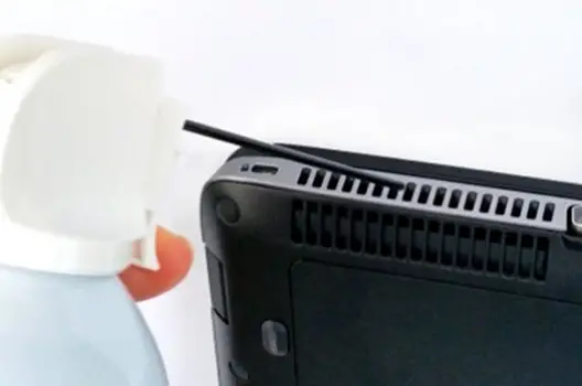 Blow Air into the Air Vents of the HP Laptop